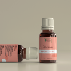 Close-up of Dreamy Drift essential oil showing the Ylang Ylang and Bergamot blend for weightless relaxation.